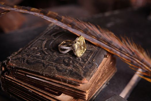 Fabulous background with the gold ring on an antique book