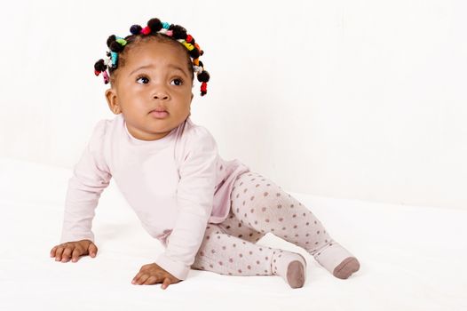 Portrait of a nice baby looking up isolated on a white background.