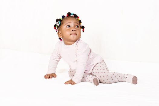 Portrait of a nice baby looking up isolated on a white background.