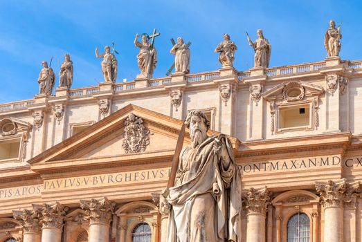 Statue of Apostle Paul in St. Peter's Square with blue sky background, Rome, Italy