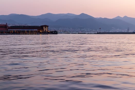 a well composed long exposure seascape shoot - there is a bay which used as restaurant. photo has taken at izmir/turkey.