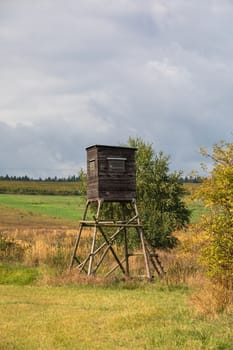 Wooden Hunters hunting tower in countryside landscape, Czech Republic, European Scenery