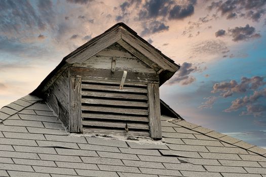 Old rustic dormer and roofline on a city building