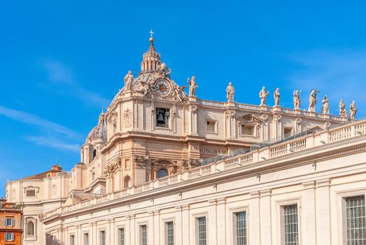 St Peter's Basilica on blue sky background. Vatican, Italy