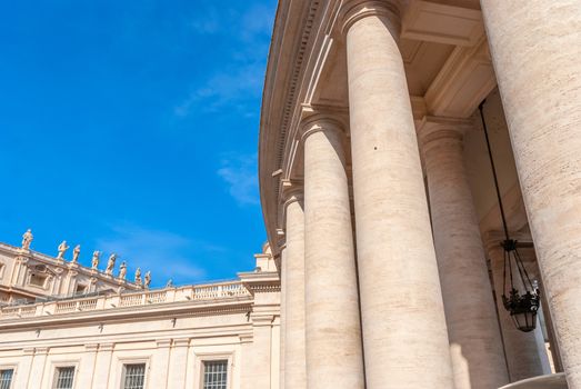 Fragments of the Papal Basilica of St. Peter in the Vatican and columns on Saint Peter s square in Vatican