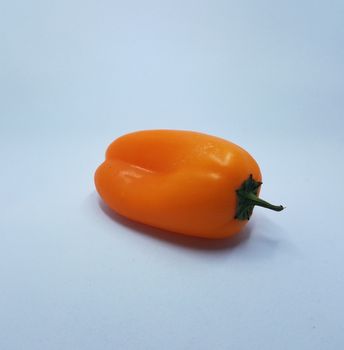 spicy orange pepper vegetable food on white background