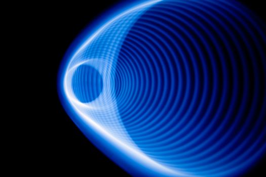 Blurred sound waves in the visible blue color in the dark
