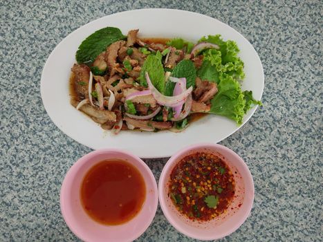 The Hot and Spicy Grilled Pork Salad on disk, Top view