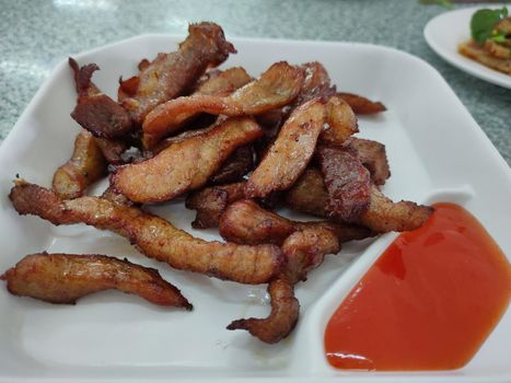 The Food deep fried dried pork. Local appetizer food in Thailand for breakfast or lunch.