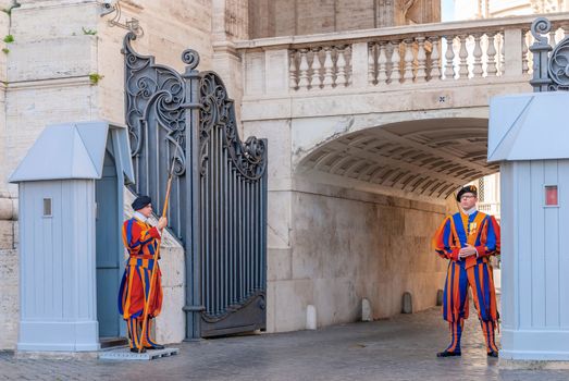 VATICAN CITY,ITALY - 22 OCTOBER 2019 : Soldiers of the Pontifical Swiss Guard standing next to Saint Peter's Square at the Vatican