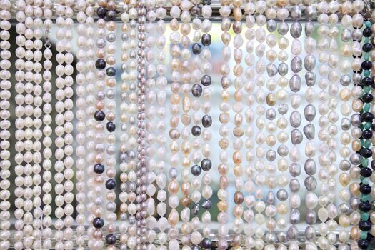 Background from multi-colored pearl jewelry