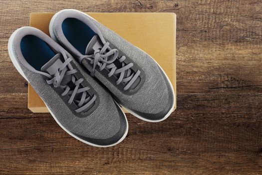 New sports footwear on wooden textures background