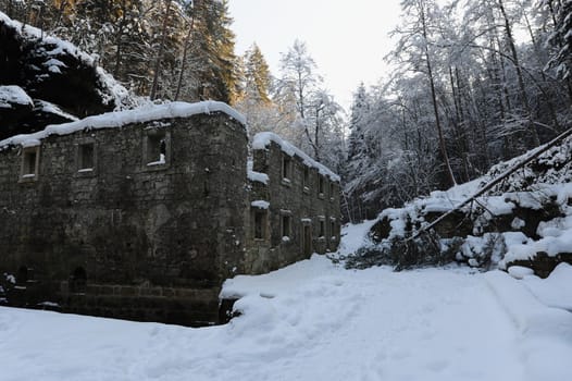 Dolsky mill in the Czech Switzerland with snow and frost