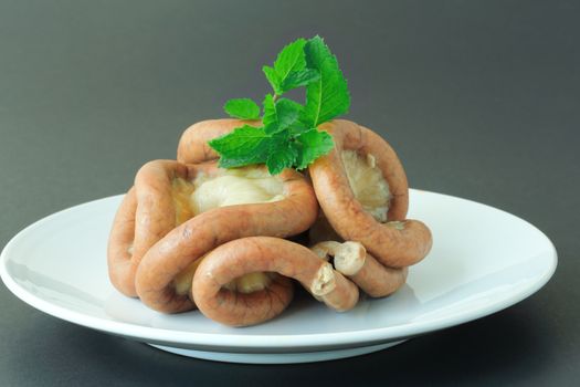 Boiled chitterlings internal organs of pig on gray background.