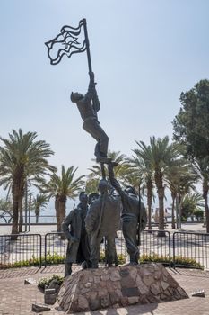 Eilat,21-march-2019:Israel Eilat sculpture Um Rash Rash by M Kapri view with palm trees sea and mountains in bkgd