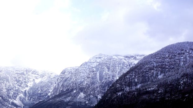 Hallstatt dreamscape winter snow mountain landscape outdoor adventure with blue sky in snowy day, Austria