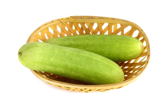 Fresh Cucumbers in basket isolated on white background