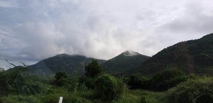 a mountain range during rainy season