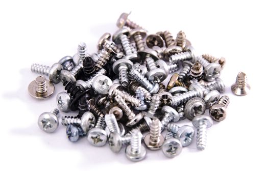  bunch of screws macro closeup on white background isolated