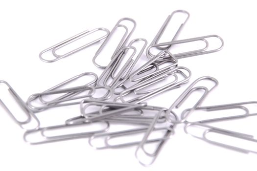 many paper clips metal clip on the white background