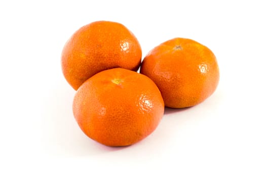 three orange Mandarin with shadow on white isolated background