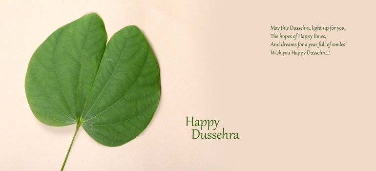 Indian Festival Dussehra, showing golden leaf . Greeting card.