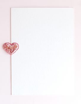 Background with copy space blank on pink background with pink glittered hearts, eucalyptus branch. White paper top view, flat lay, minimal style. Moke up card