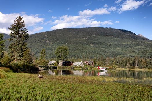 Living in the countryside with homes and airplane transportation on lake