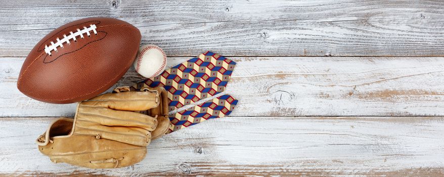 Happy fathers day concept with various sport items and dress tie on white wooden background 