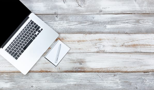 Overhead view of working desktop and writing stationery with plenty of copy space 