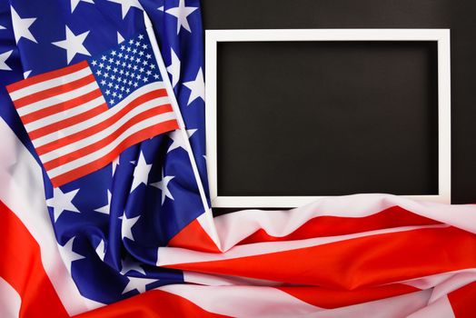 Martin luther king day, flat lay top view, American flag and photo frame on black background with copy space for your text