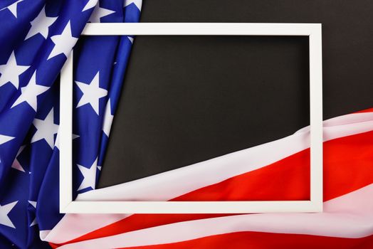 Martin luther king day, flat lay top view, American flag and photo frame on black background with copy space for your text