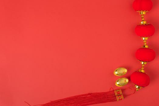 Chinese new year concept, flat lay top view, Happy Chinese new year with Red envelope and gold ingot (Character "FU" means fortune, blessing, wealth) on red background with copy space for your text