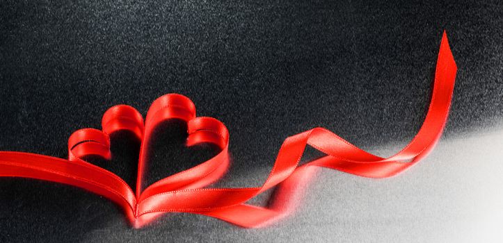Two red ribbon hearts on metal background with copy space for text, Valentines day concept