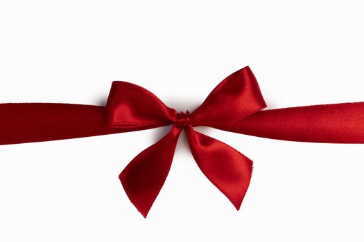 Red satin ribbon bow isolated on white background
