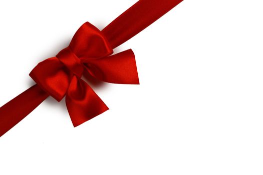 Red satin ribbon bow isolated on white background