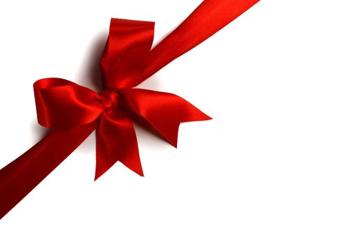 Red satin ribbon bow isolated on white background