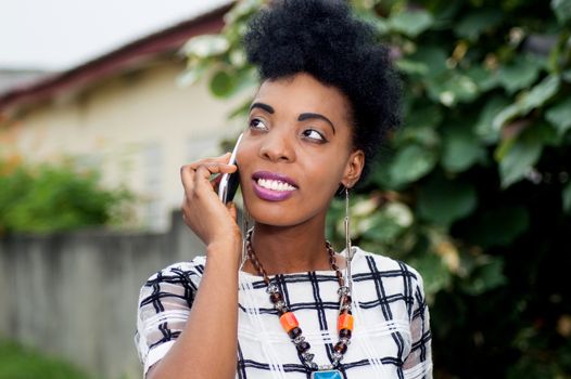 Young businesswoman smiling on the phone.