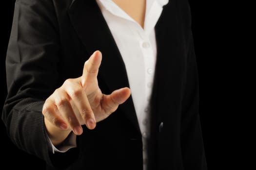 Businesswoman hand pointing finger isolated on black background, clipping path.