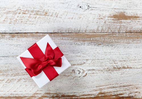 Christmas Gift box on rustic white wooden boards 