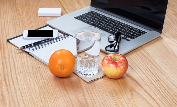 Healthy food and water with clean working wooden desktop 