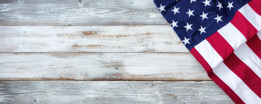 United States flag on white rustic wooden background with plenty of copy space 