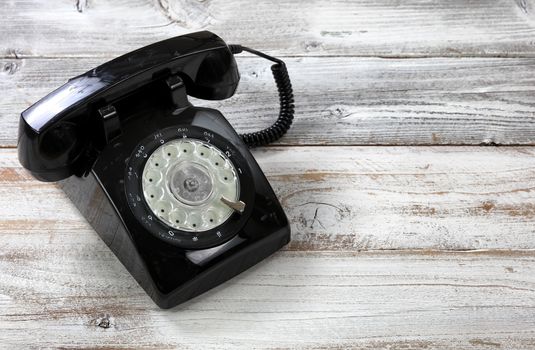 Old fashion rotary dial phone for antique technology concept in close up format 