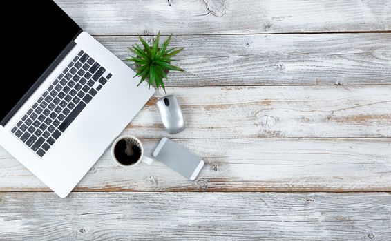 Overhead view of working desktop and coffee drink with plenty of copy space 