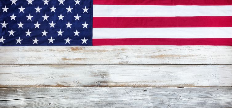 Upper border of red, white and blue American flag for Memorial Day or Veteran Day background on vintage wooden planks