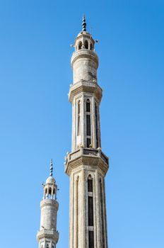 two minarets of the mosque El-Mustafa in Sharm El Sheikh on the background of the blue sky Egypt South Sinai