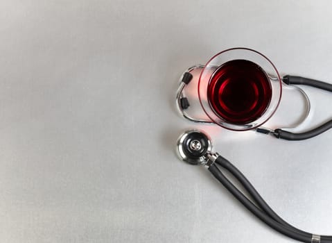 Red wine for alternative medicine on medical table 