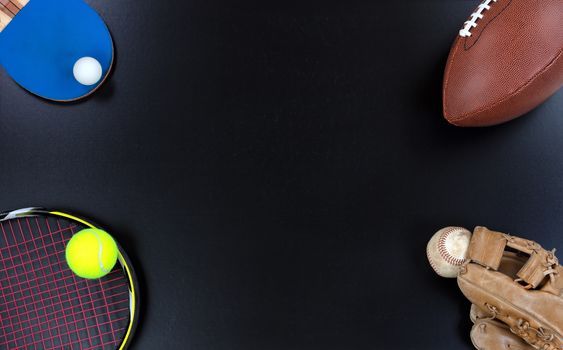 Various sports equipment located at corners of chalkboard 