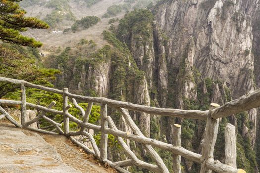 Stone and wooden fence in China's yellow mountains 