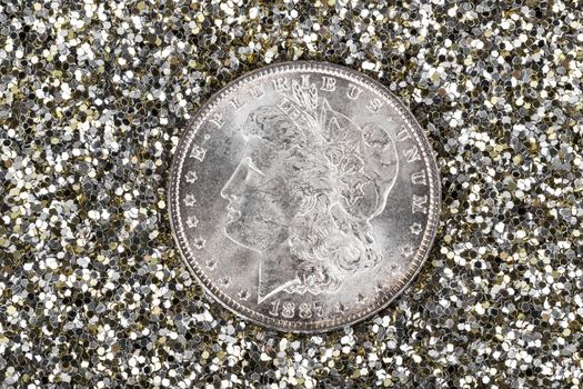 High Quality American Silver Dollar in Gold and Silver glitter background 